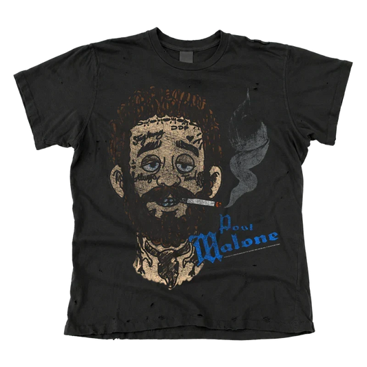 Washed black Post Malone x Cheatin Snakes tee with a cartoon smoking portrait and blue script logo