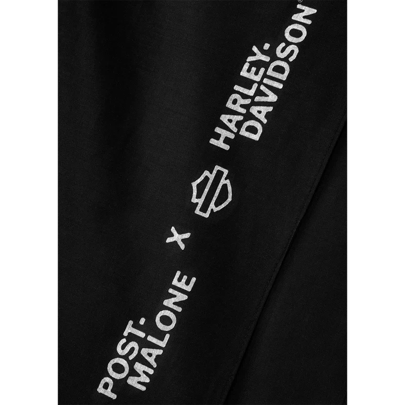 Sleeve close-up of the black Post Malone x Harley-Davidson hoodie with the bar and shield logo print