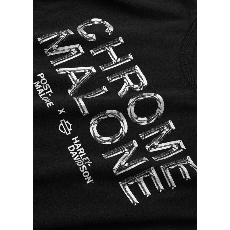 Close-up of the chrome Chrome Malone print and Harley-Davidson bar and shield on the black tee