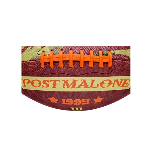 Close-up of the Wilson x Post Malone football showing the Post Malone 1995 panel and orange laces