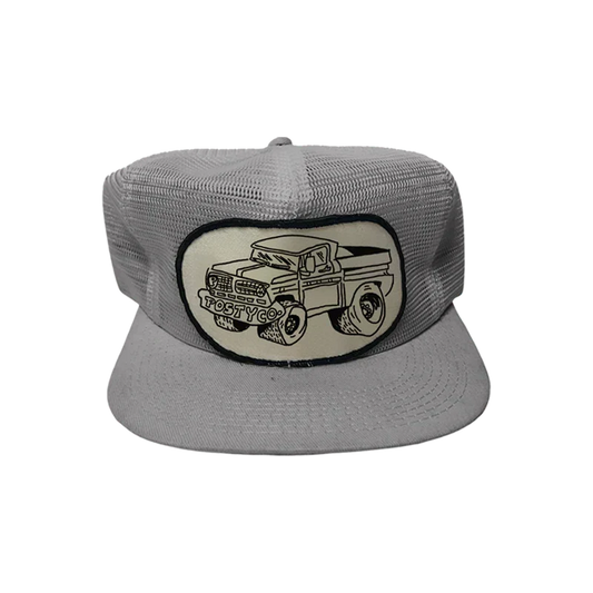 Grey Post Malone mesh trucker hat with an embroidered vintage pickup truck patch on the front