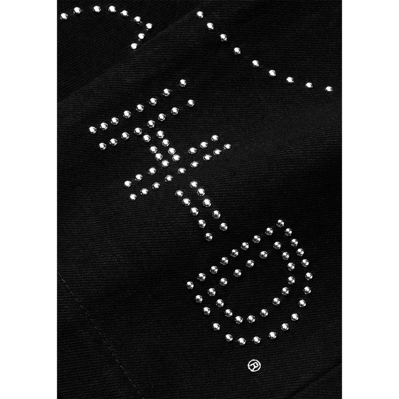 Close-up of the rhinestone H-D lettering studded into the black Post Malone denim pants