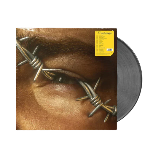 Post Malone Beerbongs & Bentleys vinyl with the barbed wire eye cover art and silver records
