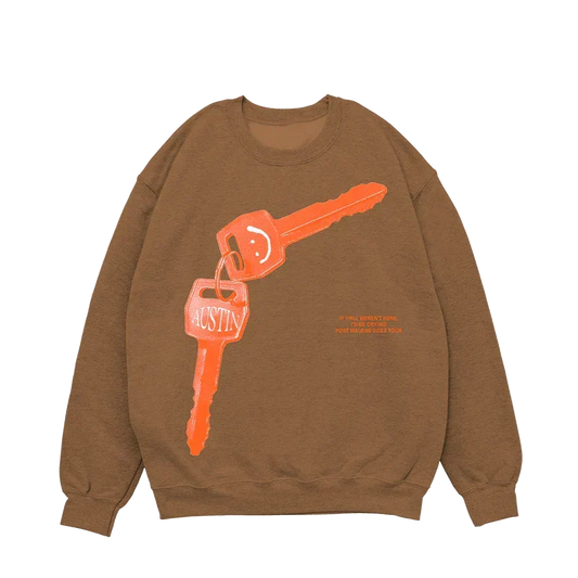 Brown Post Malone tan keys crewneck with an orange car key and keyring graphic across the chest